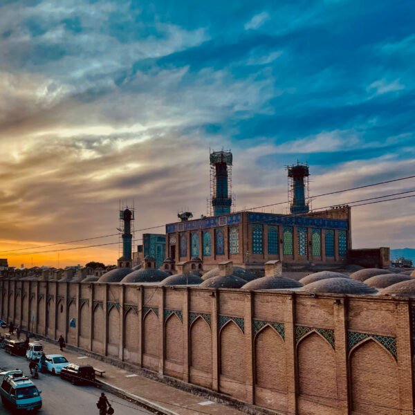 Herat Central Blue Mosque at sunset. Historical Afghan architecture bathed in warm sunset light.